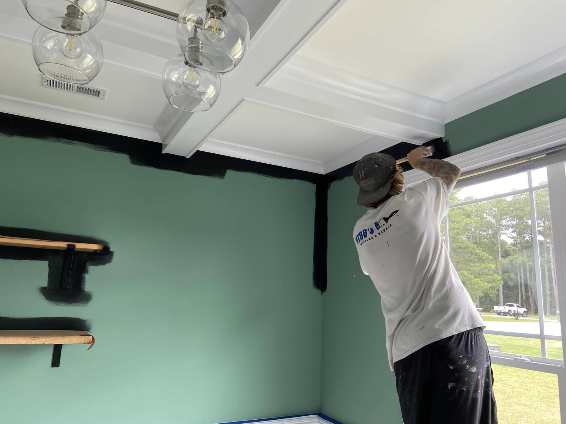 Chris Webb preparing interior trim for painting in Holly Springs, NC